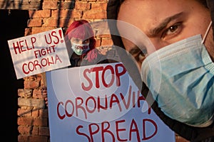 STOP CORONA SPRED Banner. Young people protest for Corona virus. Coronavirus pandemic global panic photo