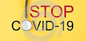 The Stop coronavirus. Coronavirus (COVID-19) outbreak is giving rise and stethoscope medical on yellow background