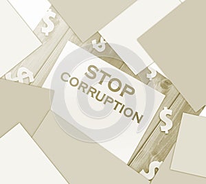 Stop Corruption Words on page and paper dollar signs around on wooden table. Anticorruption business concept photo