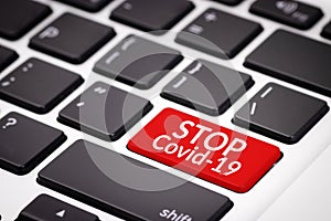 Stop covid-19 concept. red keyboard with text stop covid-19, awareness campaign on social media for prevention of coronavirus