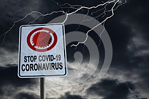 Stop Covid-19 Coronavirus Sign With Dramatic Sky and Copy Space