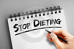 Stop Dieting text on notepad, concept background
