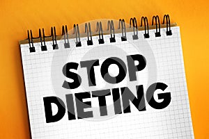 Stop Dieting text on notepad, concept background