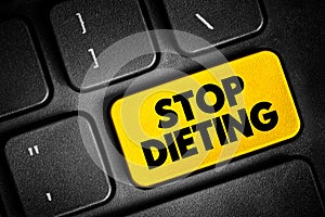 Stop Dieting text quote button on keyboard, concept background