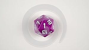 Stop frame animation of a purple D20 gaming die used for table top role playing games