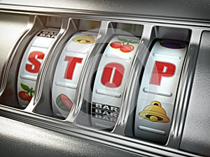 Stop gambling addiction concept. Slot machine with text stop.