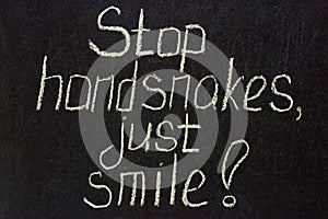 Stop handsnakes, just smile on a dark chalk board. COVID lettering