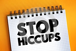 Stop Hiccups text on notepad, concept background photo