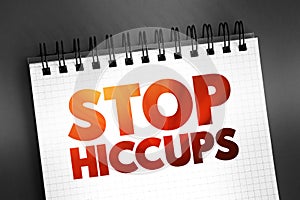 Stop Hiccups text quote on notepad, concept background