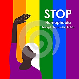 Stop Homophobia. Black LGBT woman raised her hand in protest May 17 - The International Day Against Homophobia