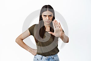 Stop, I said no. Angry frowning woman stretch out hand in block gesture, prohibit something bad, scolding person