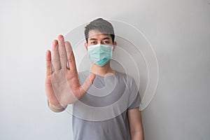 Stop the infection! Healthy man showing gesture