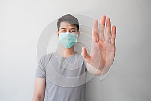 Stop the infection! Healthy man showing gesture