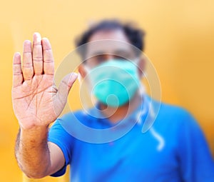 Stop the infection! Healthy man showing gesture