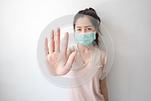 Stop the infection! Healthy woman showing gesture