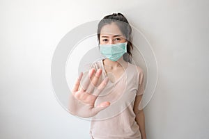 Stop the infection! Healthy woman showing gesture