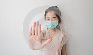 Stop the infection! Healthy woman showing gesture