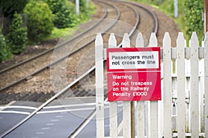 Stop look listen safety road sign at railway train station danger warning sign