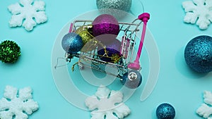 Stop motion animation New Year, toys for the Christmas tree in a basket from a supermarket. Toys in the trolley