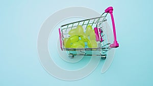 Stop motion animation supermarket idea of â€‹â€‹a set of fruits in a basket of grapes in a basket on a blue background