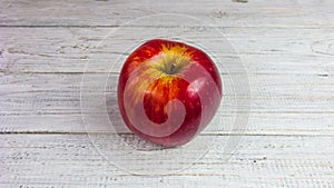 Stop motion of the measuring tape wrapped around the red apple. Timepalse of healthy lifestyle diet concept