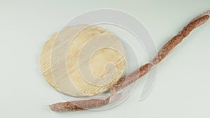 stop motion of South Tyrolean snack dish such as Tyrolean smoked sausage on a wooden cutting board accompanied by kaminwurz and