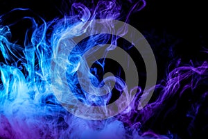 Stop the movement of multicolored smoke on dark background