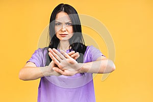 Stop or no sign! Young beautiful hispanic sad woman serious and concerned looking worried and thoughtful facial expression feeling