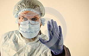 Stop. Personal protective equipment. Man wearing protective mask. Coronavirus pandemic. Garments protect health