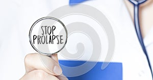 STOP PROLAPSE sign and hand with stethoscope of Medical Doctor