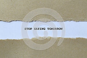 stop saying tomorrow on white paper photo