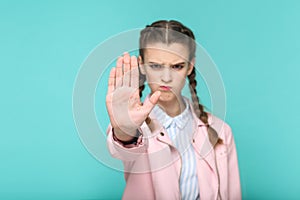 Stop it, serious portrait of beautiful cute girl standing with m