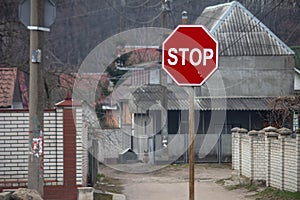 Stop sign with a beautiful background. Peaceful rural area view.