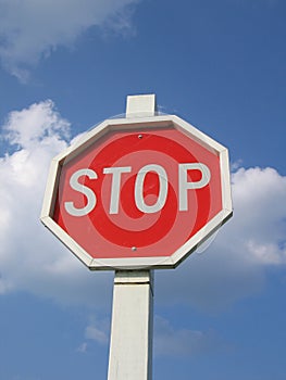 Stop Sign and Blue Cloud Sky