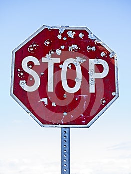 Stop Sign With Bullet Holes