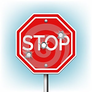 Stop sign with bullet holes photo