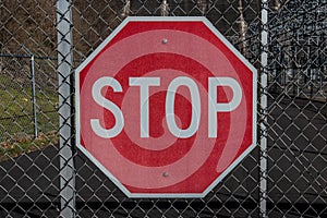 Stop Sign on Chainlink Gate