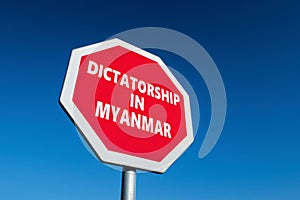 Stop sign with DICTATORSHIP IN MYANMAR text to change the results of military coup in the country photo