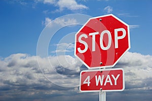 Stop sign in front of clouds