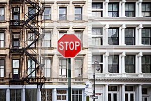 Stop Sign in front of Old Buildings in New York City