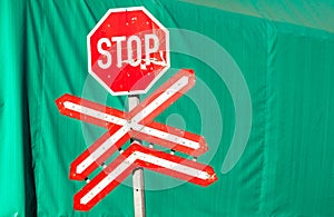 Stop Sign Green Contrasts Train Station