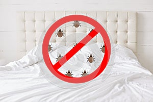 Stop sign with insects against bed background. There should be any bugs in bedroom. Hotel room being testified on cleanliness and