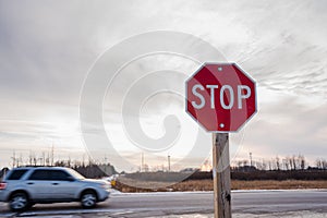 Stop Sign at an Intersection along a Highway at Sunset