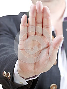 Stop sign by one palm - businessman hand gesture