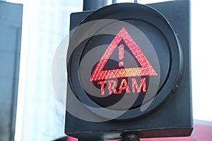 Stop sign for pedestrians in Rotterdam to warn for coming streetcars which also rings a bell.