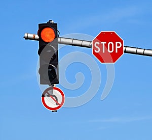 Stop sign and red traffic light