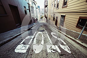 Stop sign on scenic asphalt road in residential areal of San Francisco. photo