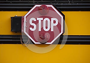 Stop sign on side of school bus