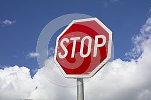 Stop sign on sky background