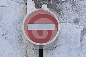 Stop Sign on a stone wall